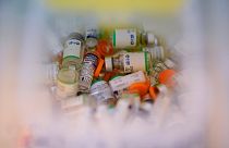 Empty vials of the Sputnik V COVID-19 vaccine and Sinopharm COVID-19 vaccine fill a container at Tecnopolis Park, in Buenos Aires, Argentina, April 15, 2021