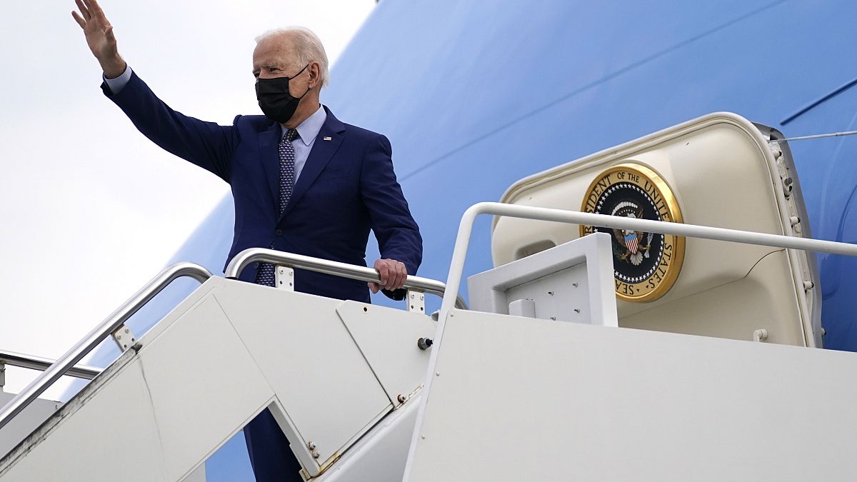 President Joe Biden waves at Dobbins Air Reserve Base, Ga., as he boards Air Force One to return to Washington, Thursday, April 29, 2021.