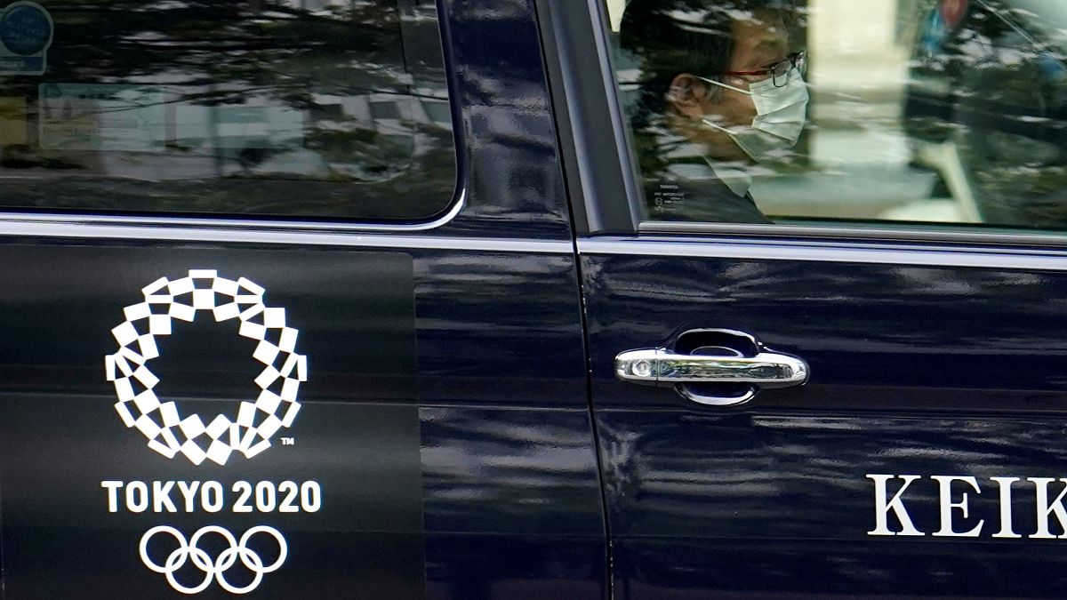 A taxi with the Tokyo 2020 Olympics logo on the door in Tokyo