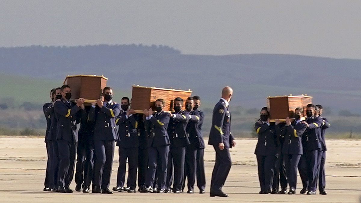 Coffins carrying the bodies of the victims arrived from Burkina Faso at Madrid's military airport on Friday.