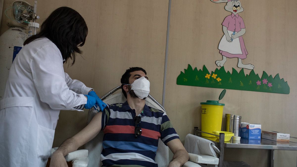 36 year-old Vasilis Tsipiras receives his first dose of the of the AstraZeneca COVID-19 vaccine, at a vaccination center in Piraeus, near Athens, April 29, 2021.