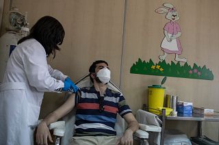 36 year-old Vasilis Tsipiras receives his first dose of the of the AstraZeneca COVID-19 vaccine, at a vaccination center in Piraeus, near Athens, April 29, 2021.