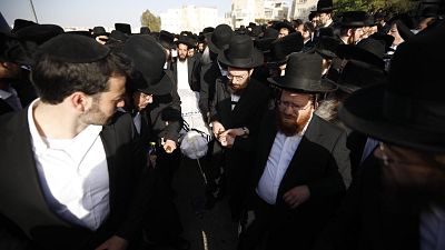 Mourners carry the body of Yhuda Libe Rubin, who died during Lag BaOmer celebrations
