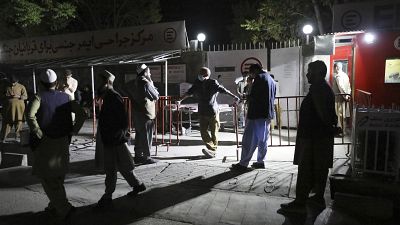 Afghans wait outside the hospital to see their relatives in Kabul, Afghanistan, Friday, April 30, 2021. Afghans wait outside the hospital to see their relatives in Kabul, Afghanistan, Friday, April 30, 2021.