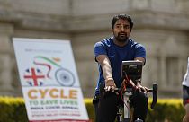 A man takes part in "Cycle to Save Lives" a 48 hour, non-stop static relay cycle challenge at the Neasden Temple in north London to raise money for relief efforts in India.fo