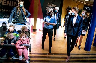 Denmark's Prime Minister Mette Frederiksen, right, meets people, during her visit to the shopping center SlotsArkaderne in Hilleroed, Denmark, Thursday 22 April 2021,