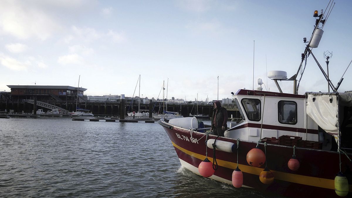 A fishing boat prepares to dock at the port of Boulogne-sur-Mer, northern France, Thursday, Dec. 10, 2020.
