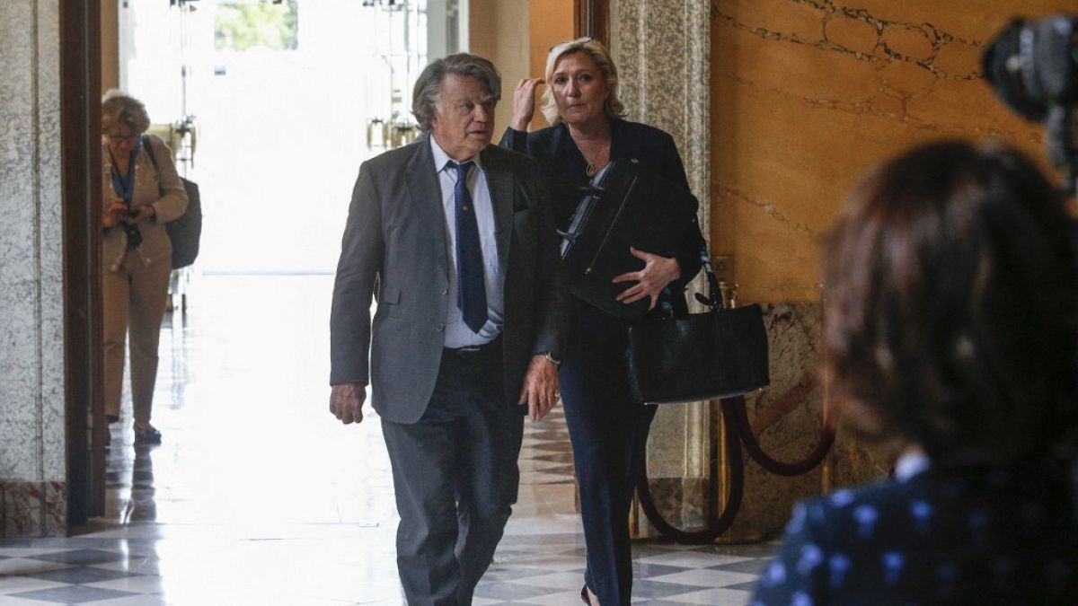 (FILE) French far-right leader Marine Le Pen (R) and Member of Parliament Gilbert Collard arrive at the  arrive at the French National Assembly in Paris, 2017. 