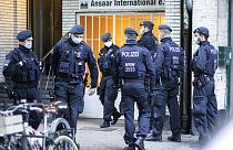 Police officers in front of an Ansaar International building in Duesseldorf, Germany on Wednesday