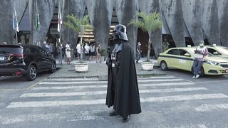 Actor dressed as Darth Vader poses outside Rio's Planetarium vaccination centre