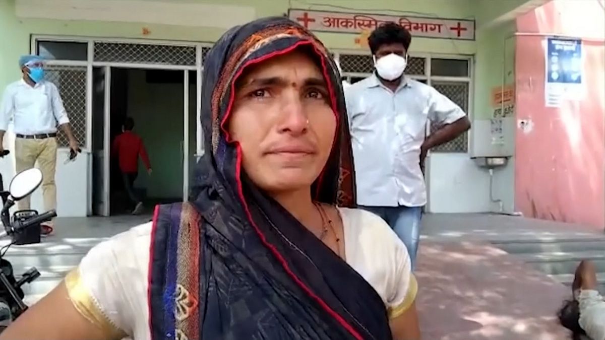 Woman crying outside hospital
