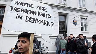 Syrian refugees hold banners outside the Swedish Embassy in Copenhagen, Denmark on Wednesday, 26 September, 2012.