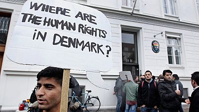 Syrian refugees hold banners outside the Swedish Embassy in Copenhagen, Denmark on Wednesday, 26 September, 2012. Syrian refugees hold banners outside the Swedish Embassy in Copenhagen, Denmark on Wednesday, 26 September, 2012.