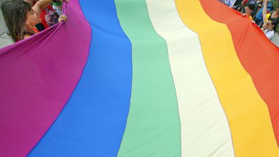 Gay rights activists carry the rainbow flag during a 2012 Pride march in Split, Croatia.