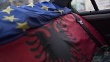 An EU flag and an Albanian flag cover the back seats of a car in the town of Ballsh, Albania on Thursday July 9, 2020. 