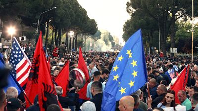 In this Saturday, May 25, 2019 file photo, protesters take part in an anti-government rally, demanding the resignation of the Socialist Prime Minister Edi Rama, in Tirana. In this Saturday, May 25, 2019 file photo, protesters take part in an anti-government rally, demanding the resignation of the Socialist Prime Minister Edi Rama, in Tirana.