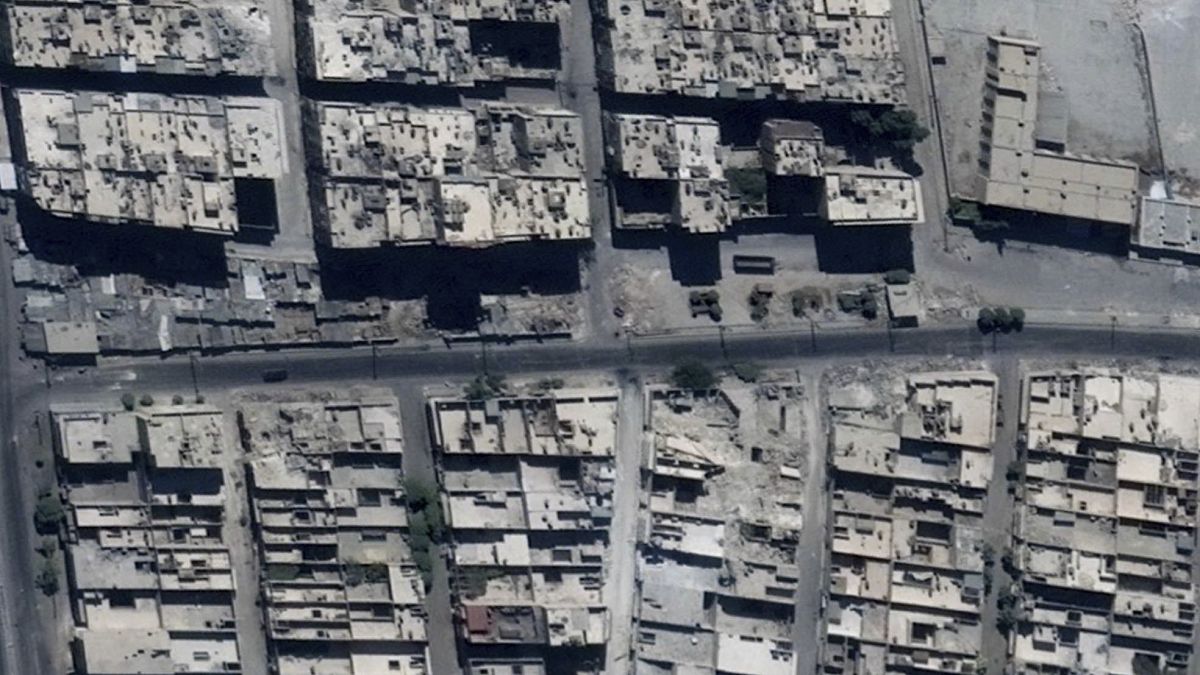 This satellite image shows road damage and craters, in the Sha'ar district of Aleppo, Syria, Sept. 18, 2016. 