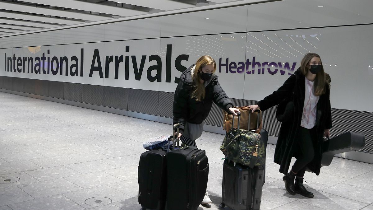 In this Jan. 17, 2021 file photo travelers arrive at Heathrow Airport in London