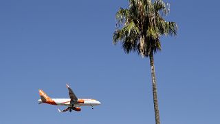 FILE - In this Aug. 21, 2019 file photo, an easyJet airplane approaches Lisbon airport for landing. 