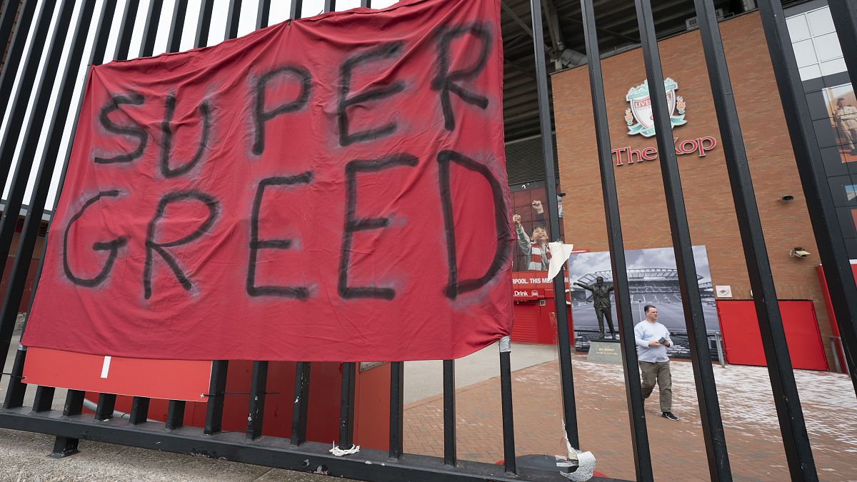 In this file photo dated Wednesday, April 21, 2021, a protest banner against the proposed Super League is seen outside Liverpool's Anfield Stadium