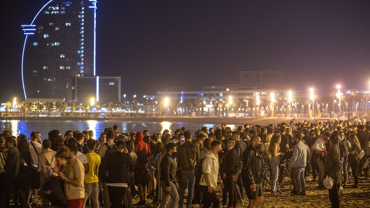 People crowded on the beach in Barcelona, Spain, Sunday, May 9, 2021.