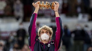 Germany's Alexander Zverev holds the trophy after winning the men's final match against Italy's Matteo Berrettini
