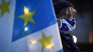 Pro-Scottish independence activist holds a flag mixing the EU flag and the Scottish Saltire