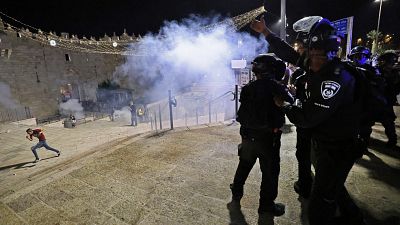 Israeli security forces disperse people from Jerusalem's Damascus Gate.