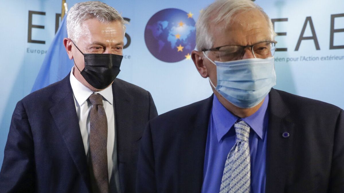 UN High Commissioner for Refugees Filippo Grandi, left, walks with EU foreign policy chief Josep Borrell prior to a meeting at the EEAS building in Brussels, Tuesday, May 11, 