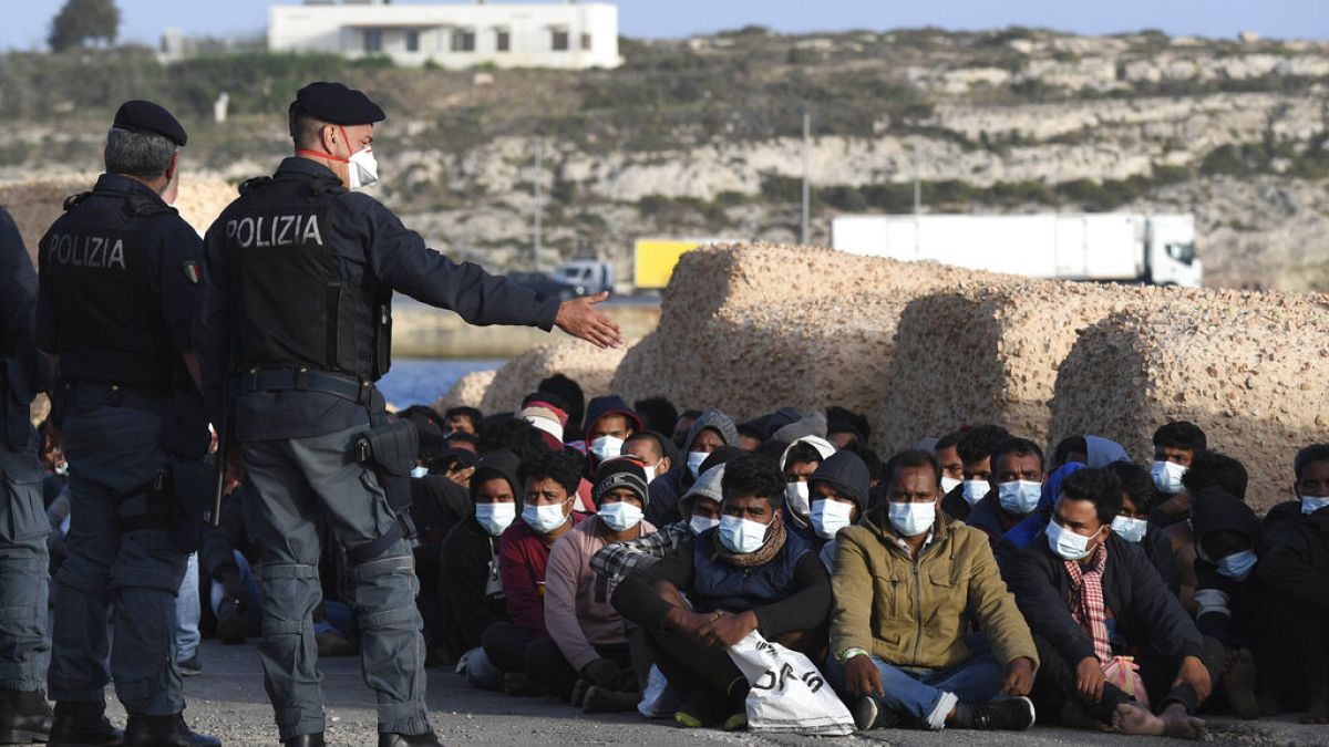 Migrantes em Lampedusa