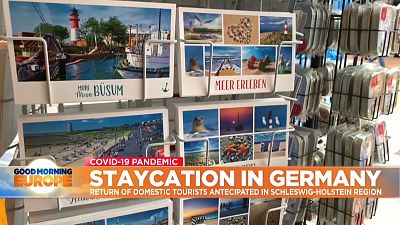 Postcards stand in seaside resort in Northern Germany.