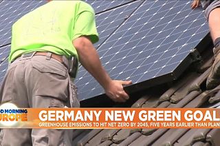 Solar panels being assembled on rooftop.