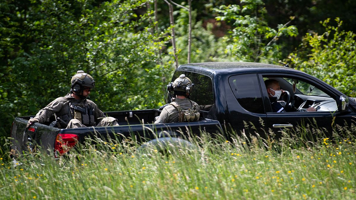 Snipers from the French National Gendarmerie Intervention Group (GIGN) near the village of Plantiers, in the Cevennes region, southern France on May 12, 2021.