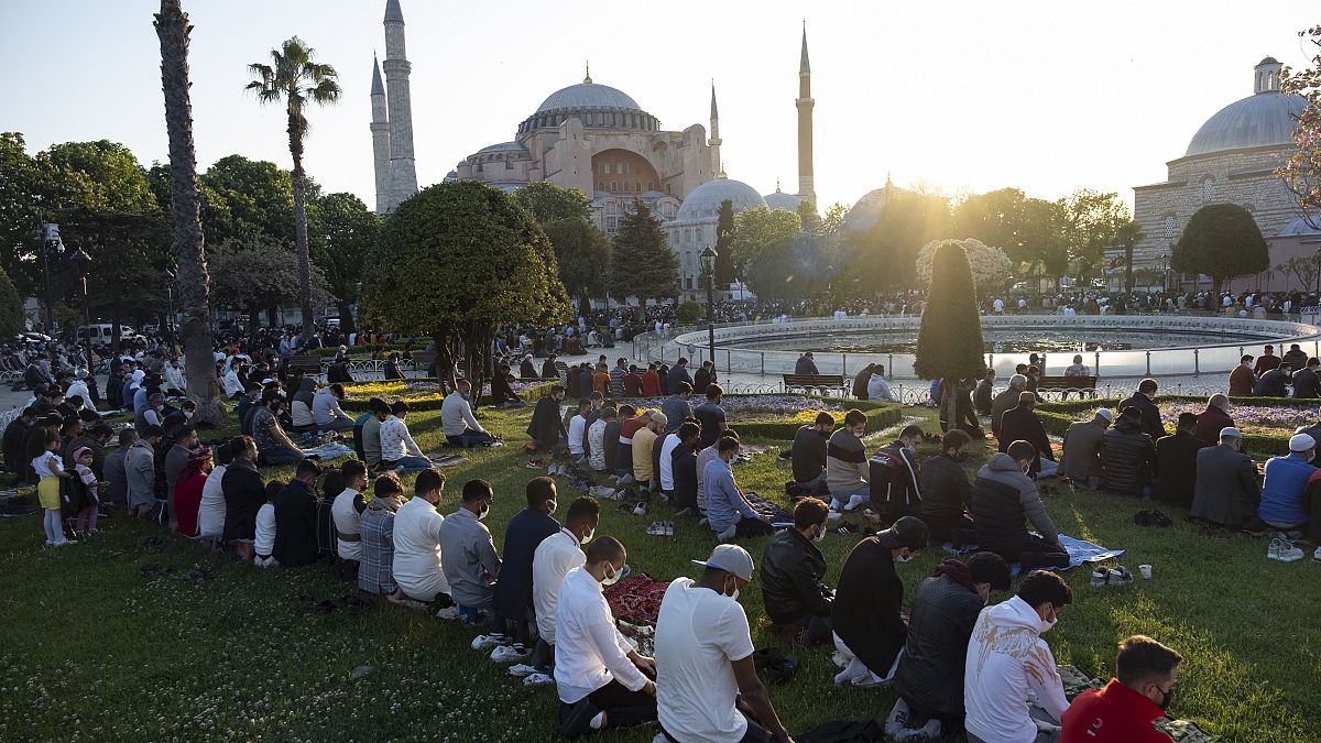 Muslims offer prayers during the first day of Eid al-Fitr, which marks the end of the holy month of Ramadan, outside the Byzantine-era Hagia Sophia.