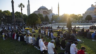 Muslims offer prayers during the first day of Eid al-Fitr, which marks the end of the holy month of Ramadan, outside the Byzantine-era Hagia Sophia.