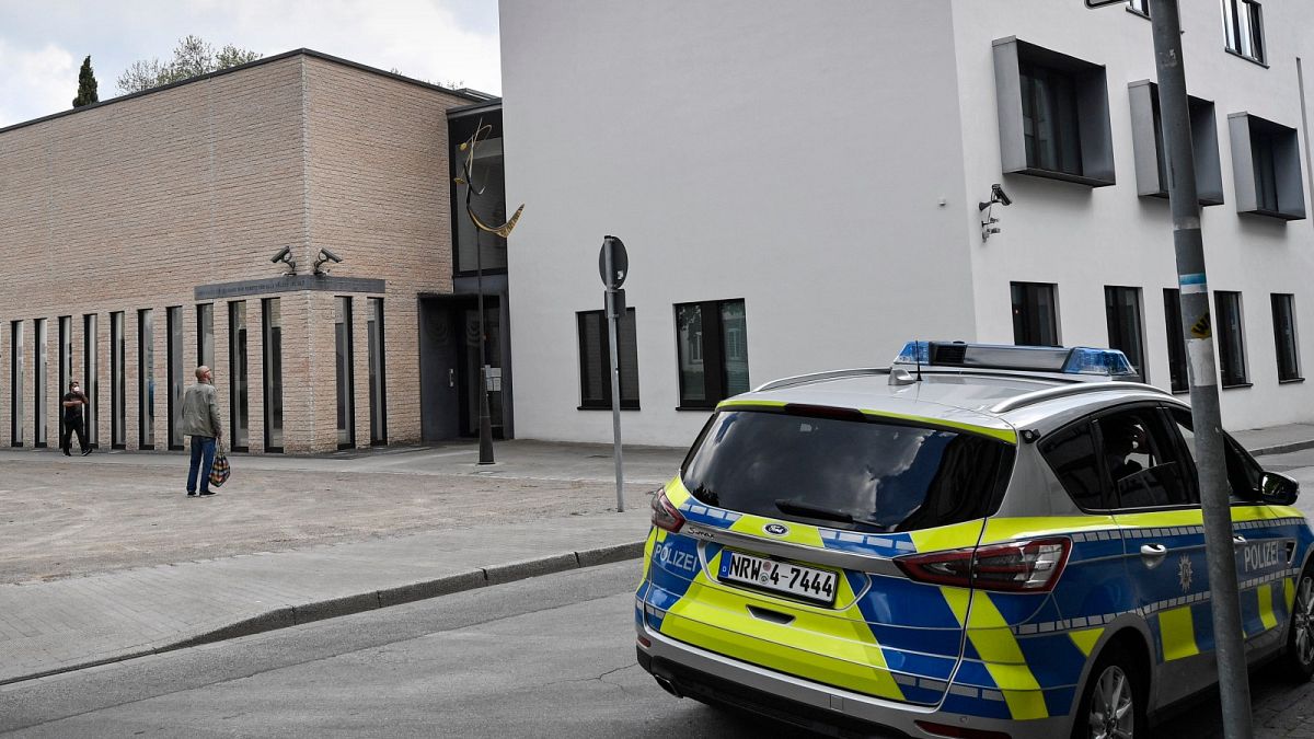 A police car stands in front of the synagogue in Gelsenkirchen, Germany, Thursday, May 13, 2021