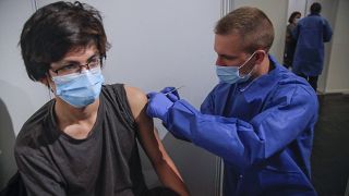 A man receives a Pfizer COVID-19 vaccine at a new vaccination center run by the Paris' fire brigade in Paris, Thursday, May 6, 2021. 