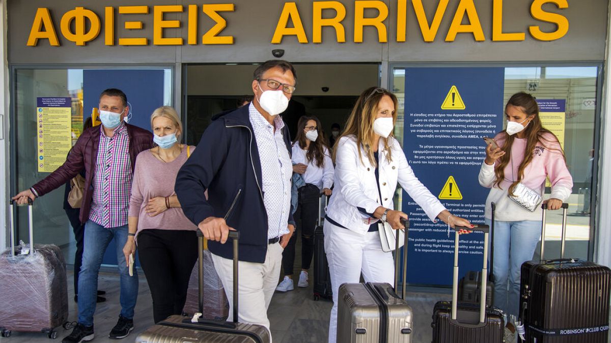 Passengers from Hanover arrive at Nikos Kazantzakis International Airport in Heraklion,