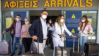 Passengers from Hanover arrive at Nikos Kazantzakis International Airport in Heraklion, on the island of Crete, Greece, Friday, May 14, 2021