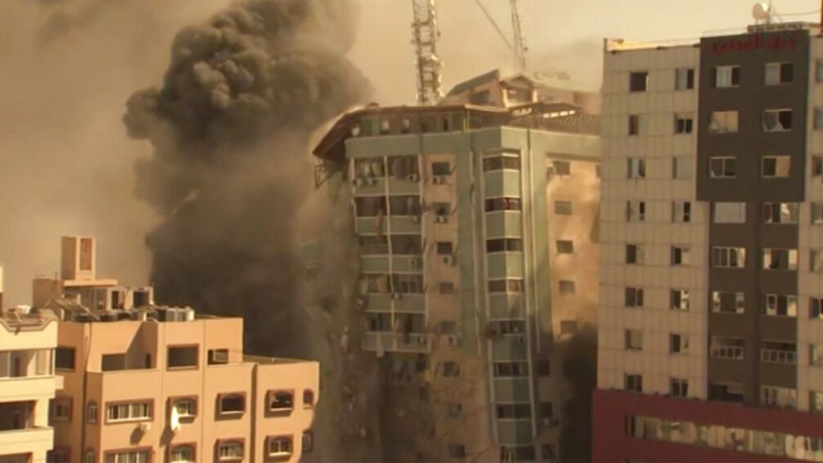 A building housing various international media, including The Associated Press, collapses after an Israeli airstrike