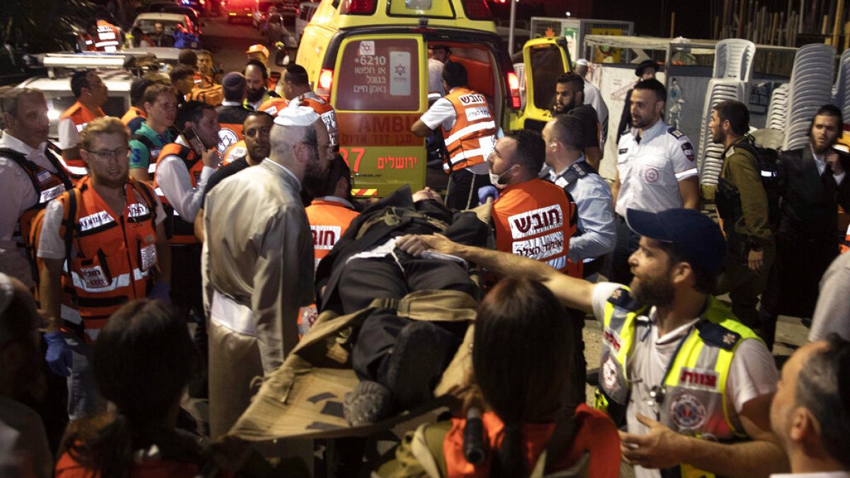 Paramedics tend to the wounded outside the synagogue in Givat Zeev, near Jerusalem