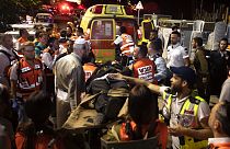 Paramedics tend to the wounded outside the synagogue in Givat Zeev, near Jerusalem