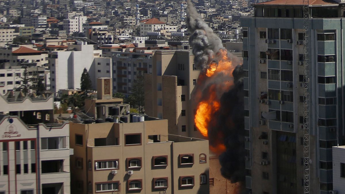An Israeli airstrike hits the high-rise building housing The Associated Press' offices in Gaza City