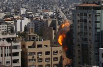An Israeli airstrike hits the high-rise building housing The Associated Press' offices in Gaza City