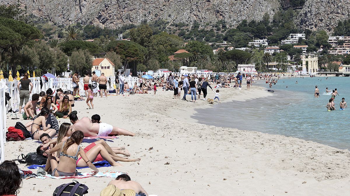 A view of the beach of Mondello, Sicily, crowded with sunbathers after the slowdown of the diffusion of Covid-19 virus allowed the reopening of beaches in Sicily. 