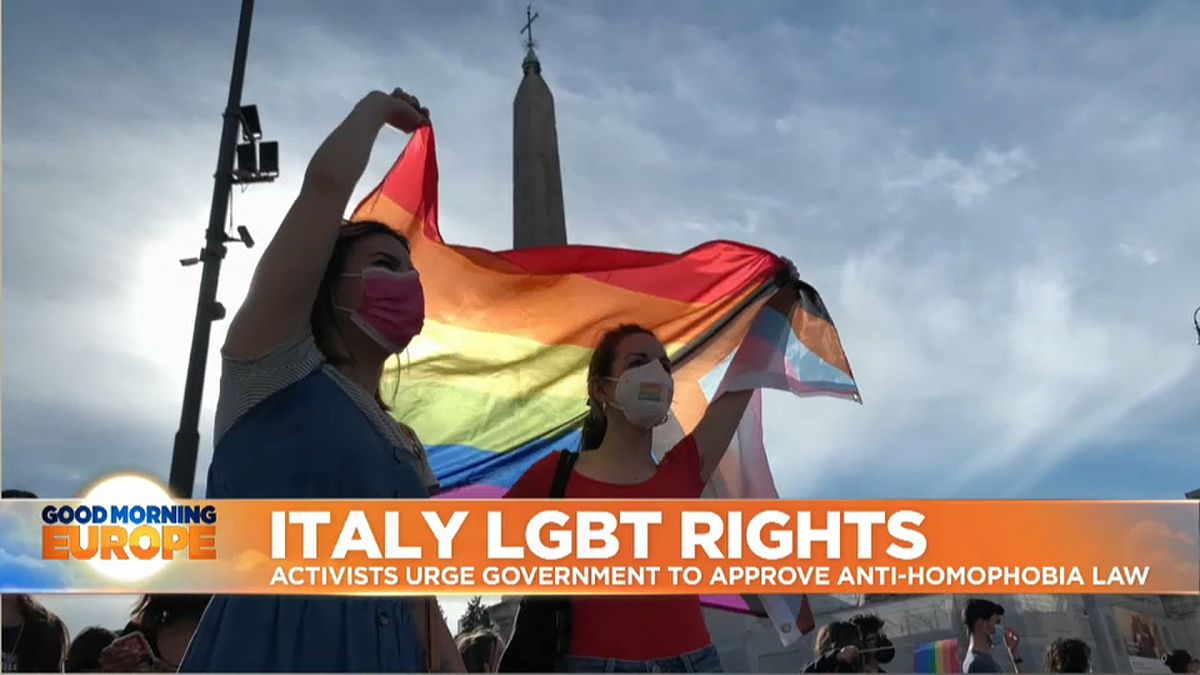 LGBTQ flag held up by activists in Central Rome, Italy