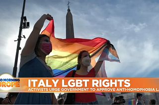 LGBTQ flag held up by activists in Central Rome, Italy