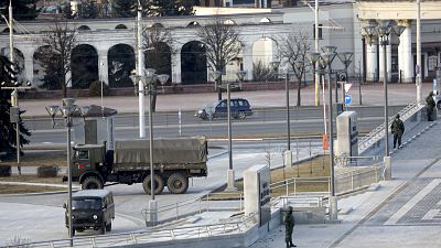 Belarusian interior ministry guard an empty street to prevent a rally in March.