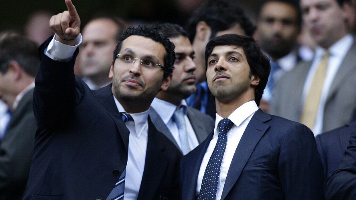 Manchester City's owner Sheikh Mansour, right, is seen with chairman Khaldoon Al Mubarak before his team's English Premier League soccer match against Liverpool