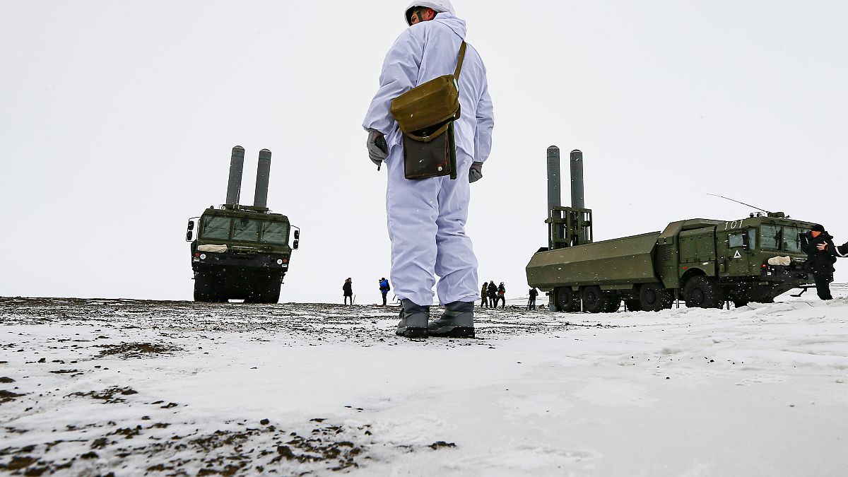 An officer stands as the Bastion anti-ship missile systems take positions on the Alexandra Land island near Nagurskoye, Russia, Monday, May 17, 2021.